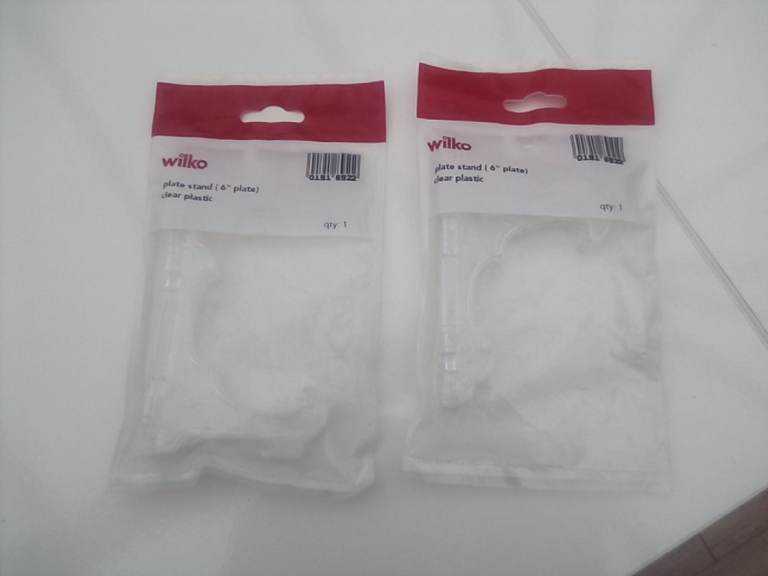 2 x brand new plate stands - £1 the two.