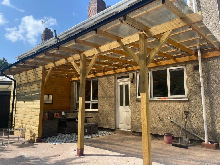 Pergola with bronze roof and 2 cladding walls