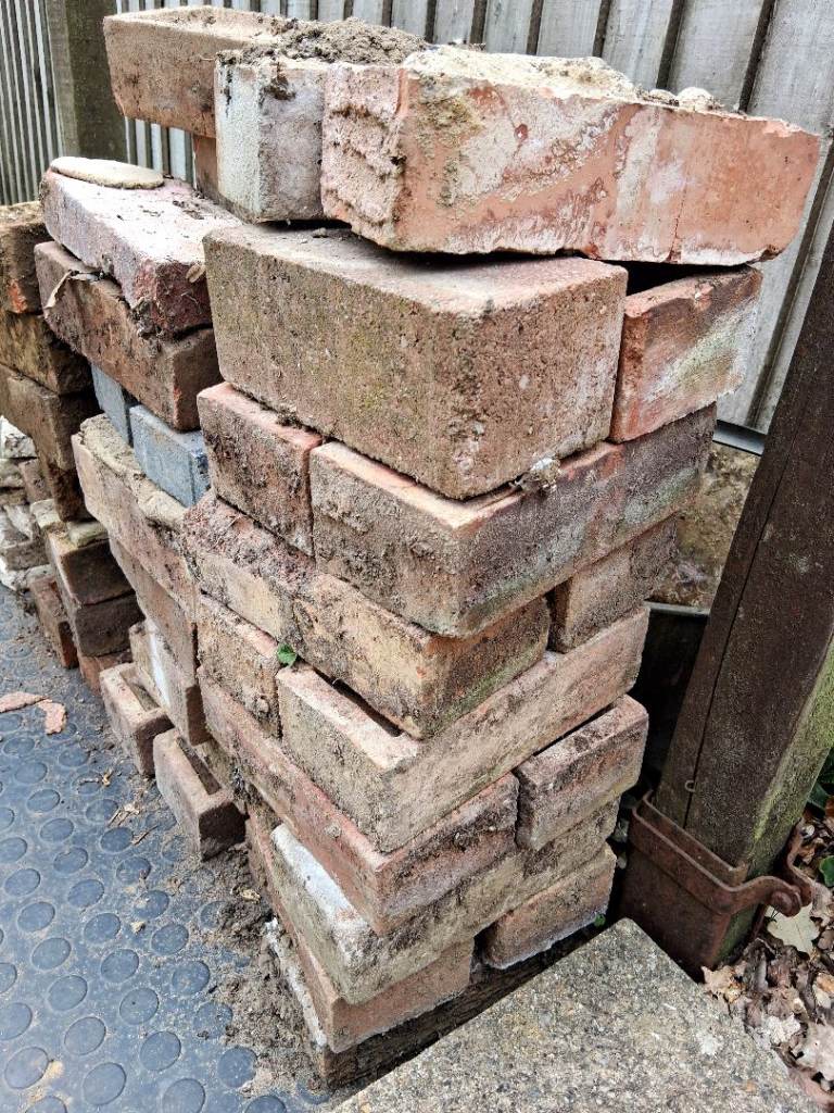 Free to collect - approx 100 x London BRICKS . Indian Sandstone slabs. Broken patio slabs