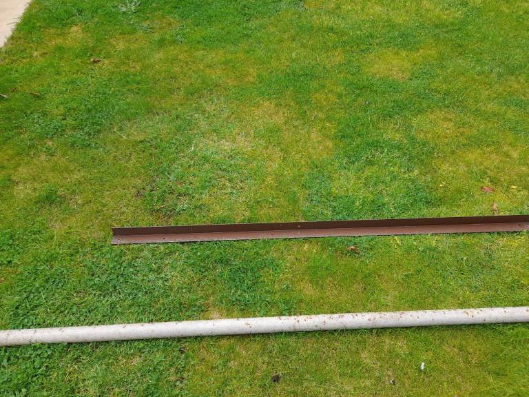 Strong metal pole and length of angle iron