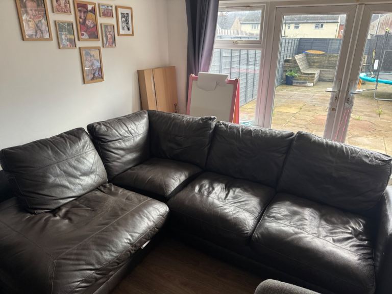 Dark brown leather corner sofa (bed)