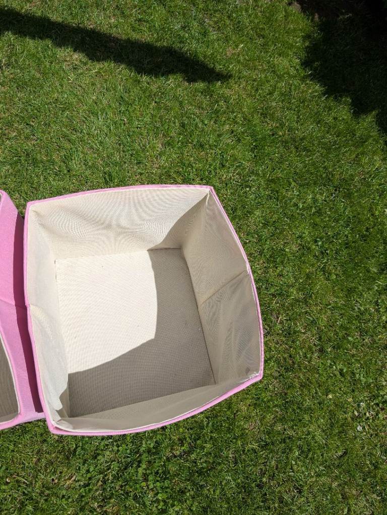 Two pink storage boxes