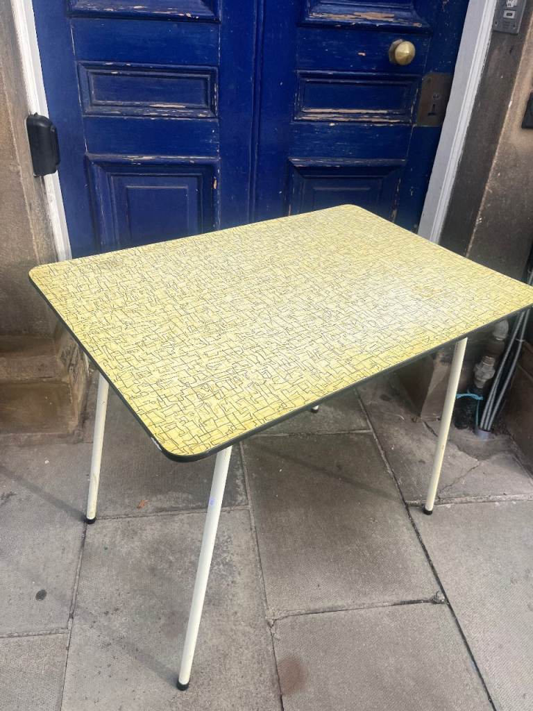 Retro Kitchen Table , metal legs . Yellow in colour . Great size for space saving .