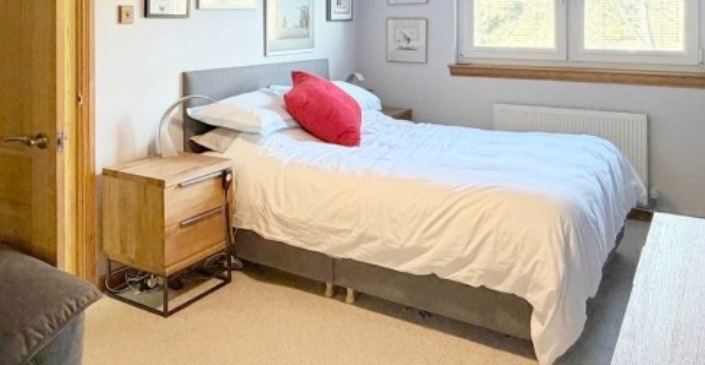 Electric adjustable double bed with grey headboard 
