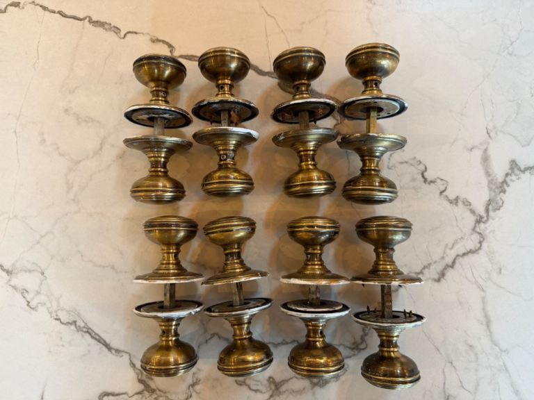 Antique brass reeded door knobs with spindles (4 sets, 8 knobs) plus thumb lock