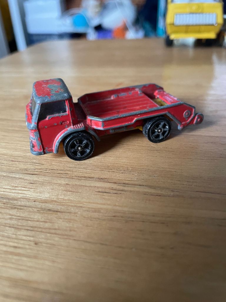 Vintage Corgi Juniors Ford D-1000 Skip Lorry die-cast toy truck.