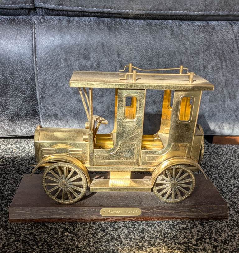 Vintage Brass Taxi on wooden plyth 