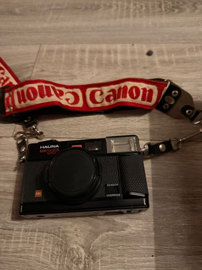 Halina Micro 110 EF Camera with Canon Strap – Good Condition
