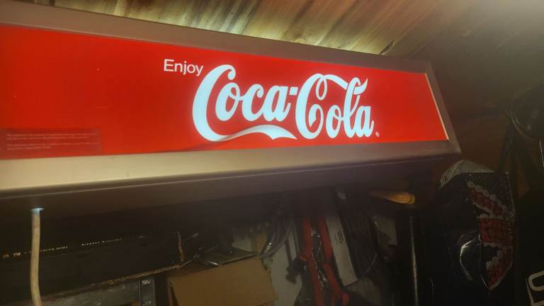 Two coke advertising signs 