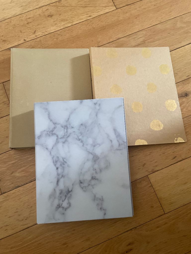 Three used two ring binders