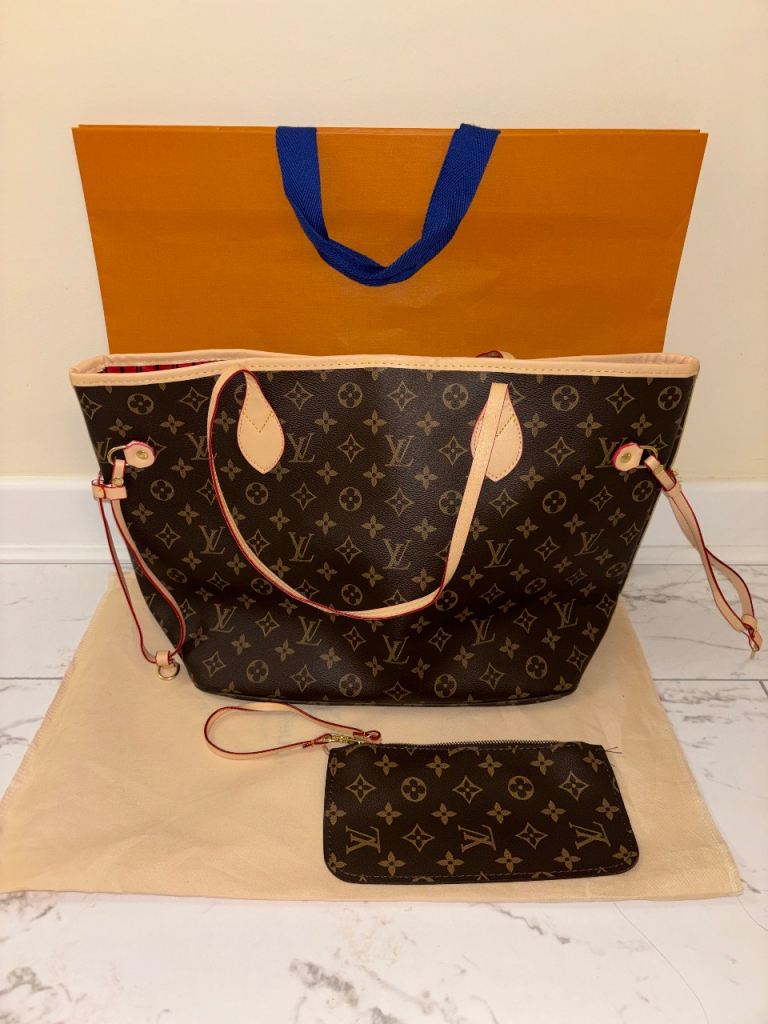 Genuine Large Louis Vuitton giftbag with a free unbranded handbag.