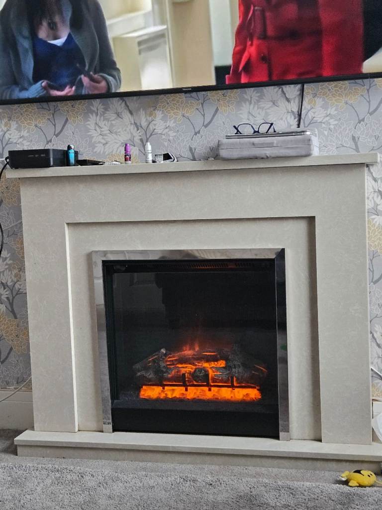 Electric fire and marble surround 