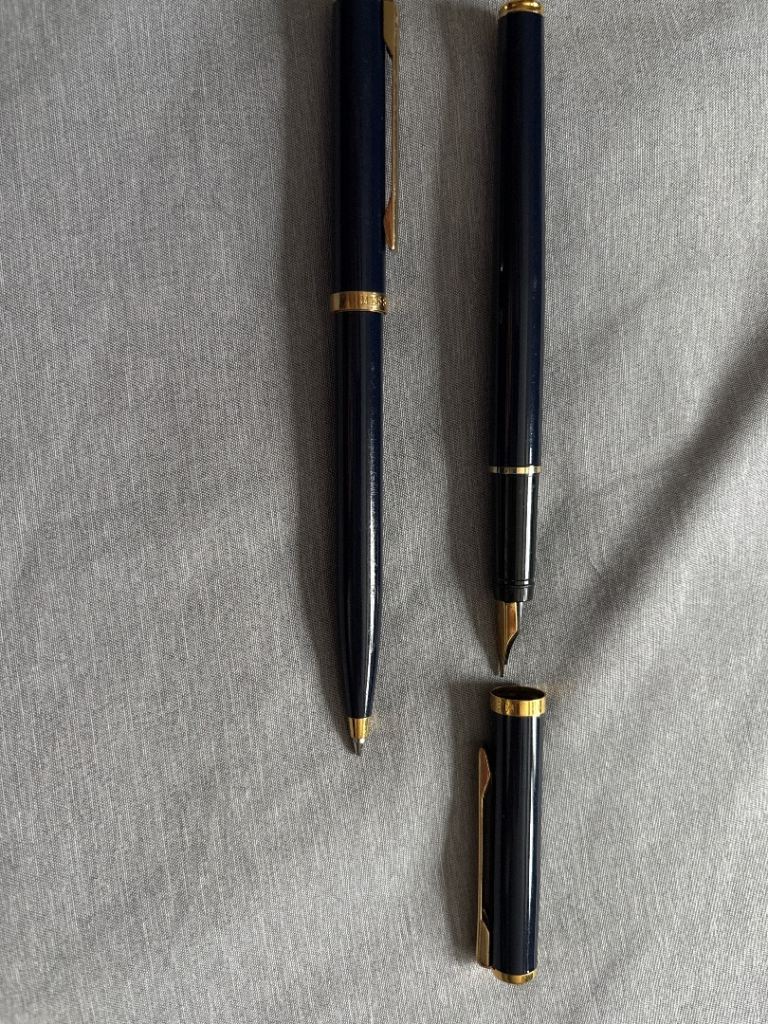 one fountain and one ball point Messenger pens