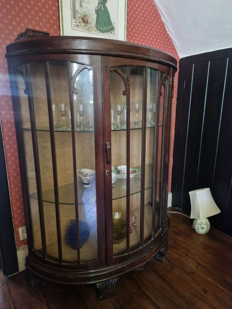 Bow front glass cabinet 