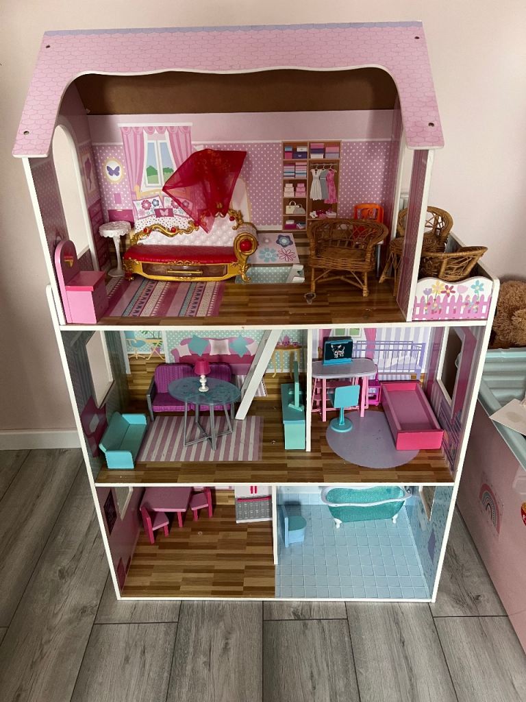 Large doll house with lots of furniture