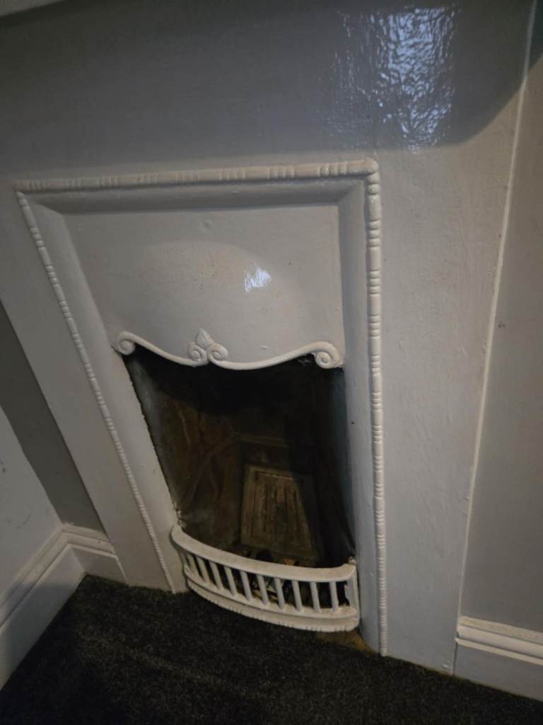 Old cast iron fireplace and mantle
