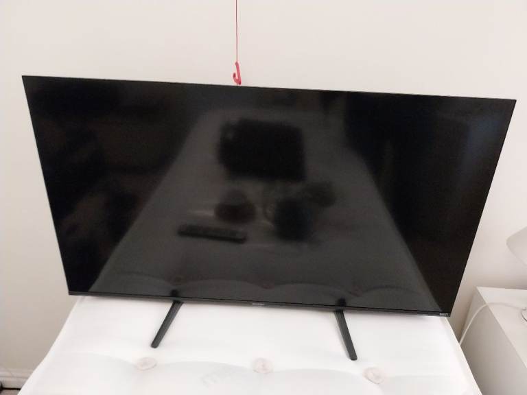 Flat Screen TV with Stand – Good Condition
