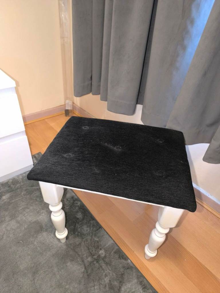 White and black upholstered stool