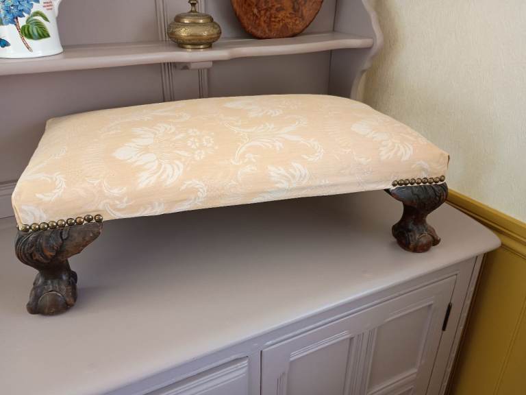 Antique ball and claw footstool in cream Damask silk 