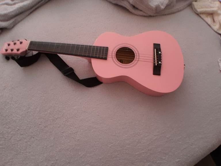 Pink acoustic guitar