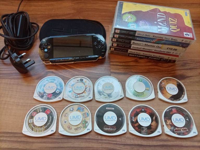 Sony PSP with charger, 14 games and 2 movies