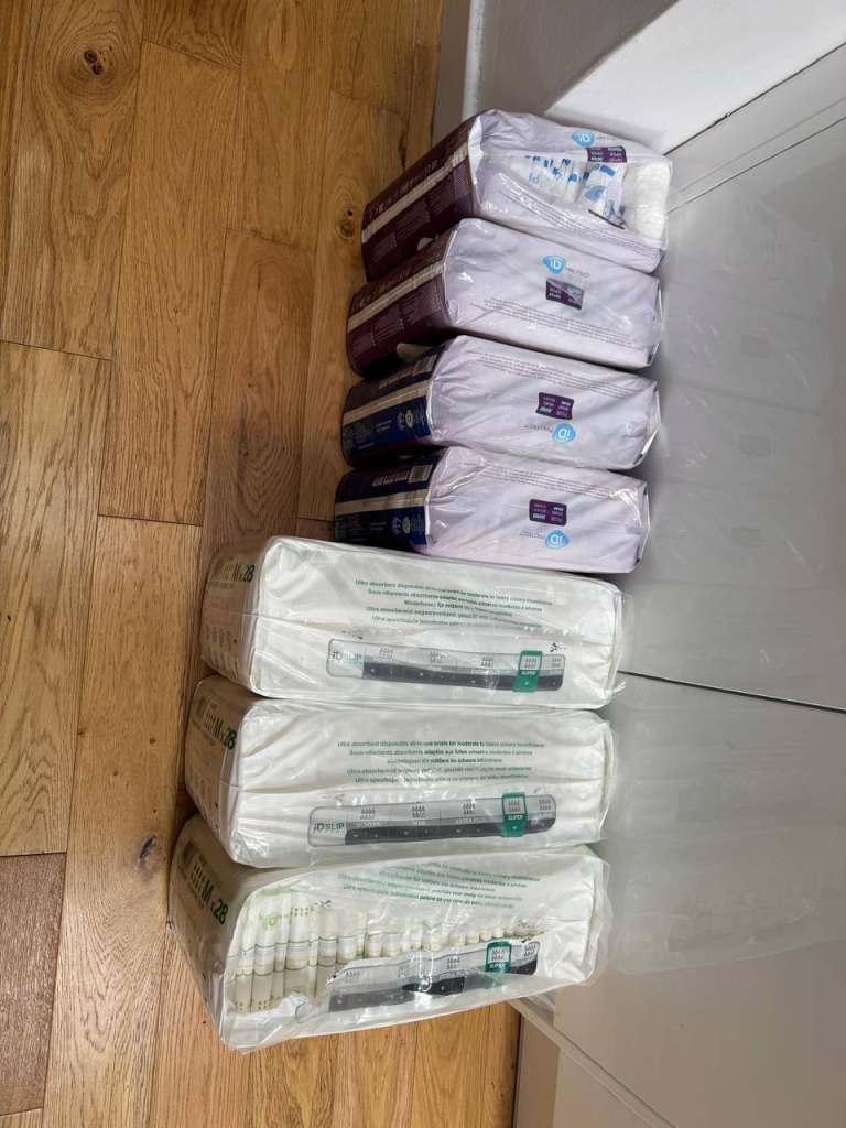 Lot of incontinence briefs and underpads