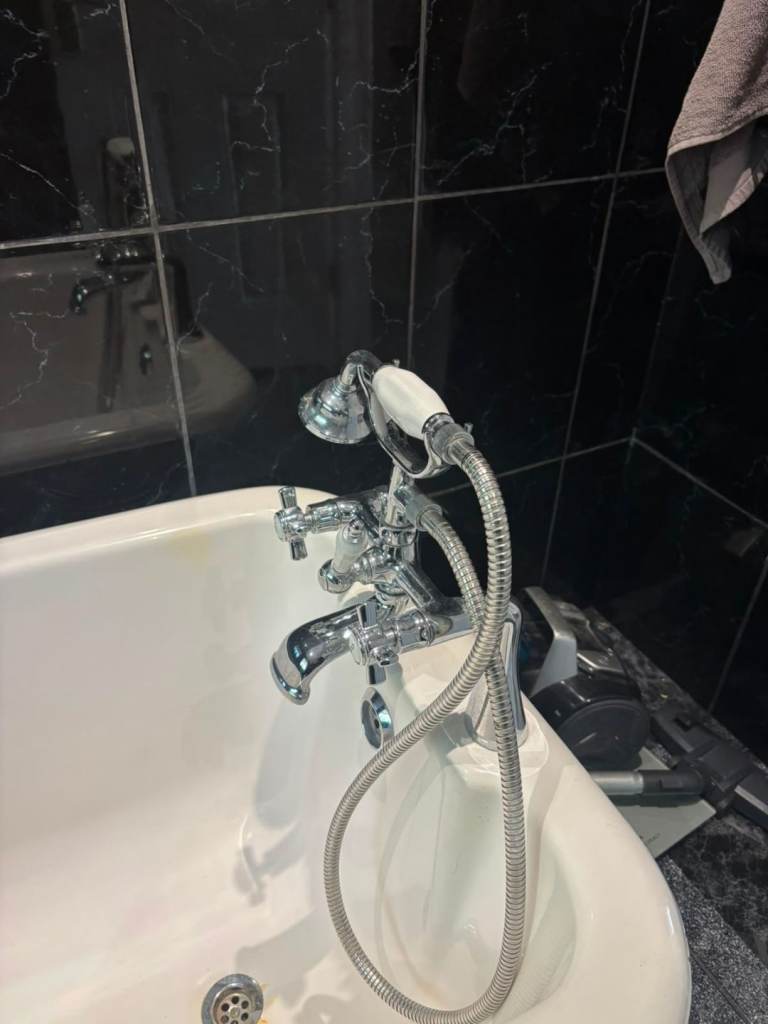 White Freestanding Roll Top Bath with Taps and Shower Head