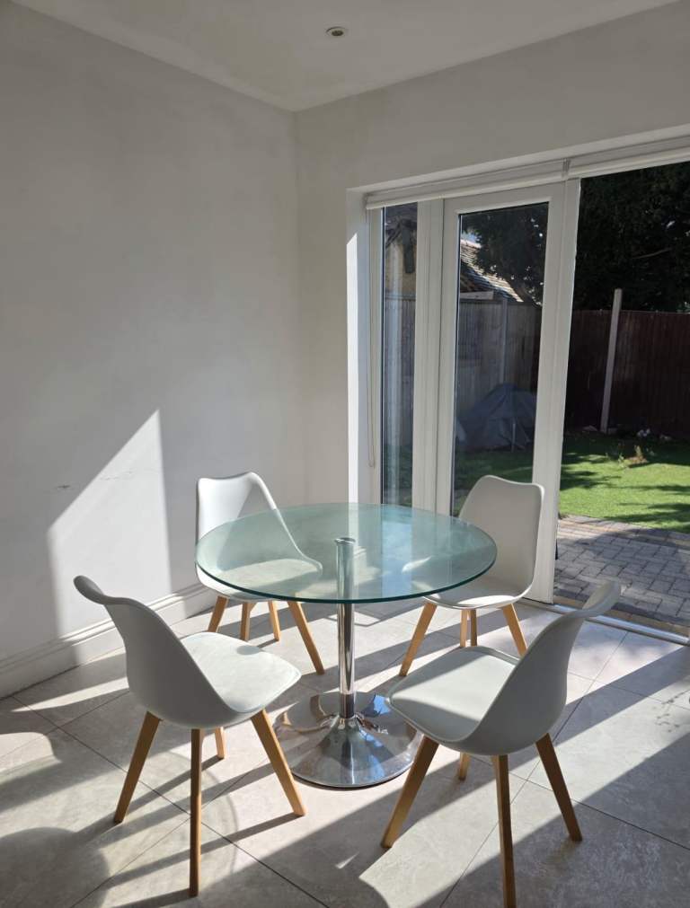 Glass Dining Table with 4 White Chairs – Good Condition