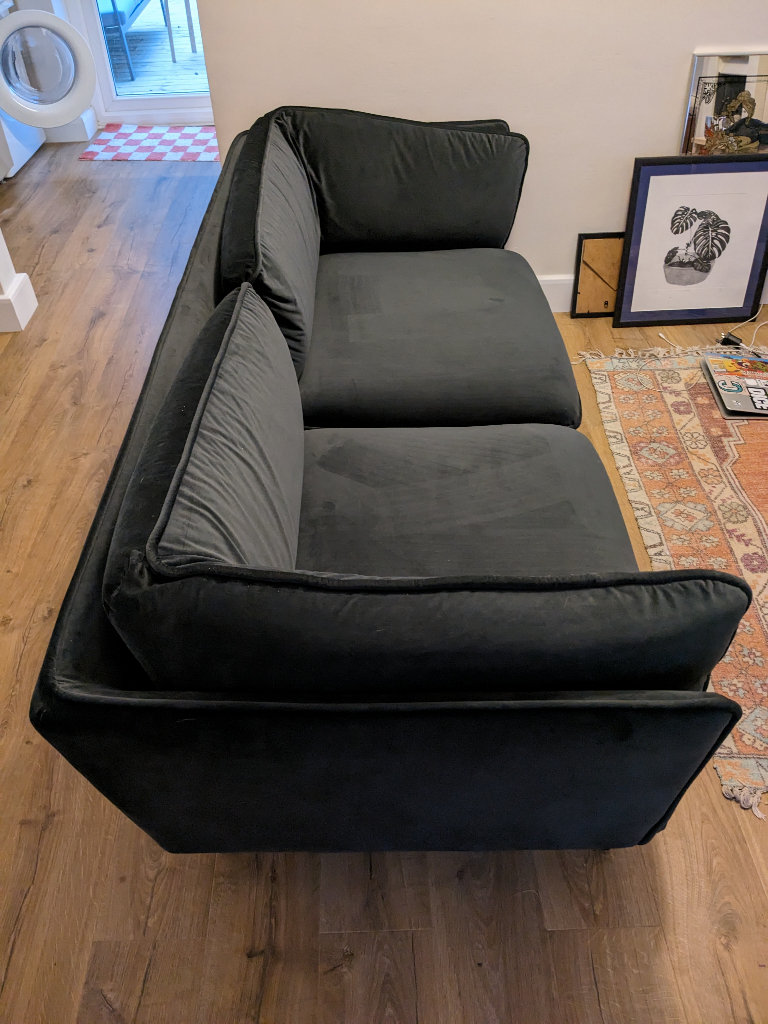 Dark grey velvet sofa from Made