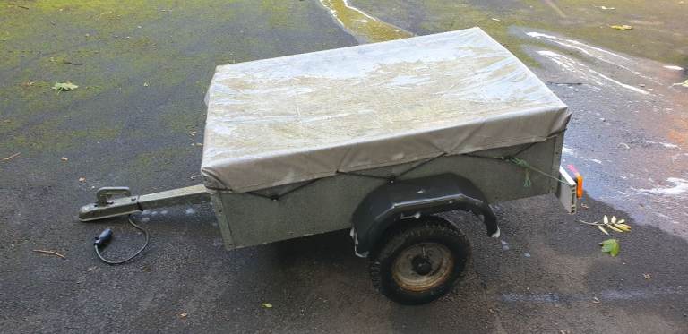 SMALL TRAILER 4 x 6 FT with one brand new tyre.  Elasticated Cover and electric hook-up