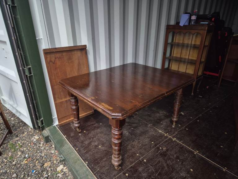 Antique mechanical extending dining table
