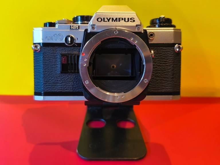 Olympus OM10 35mm vintage film camera body. Film tested. 