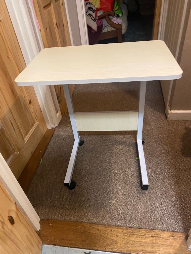 Over the bed adjustable height table 