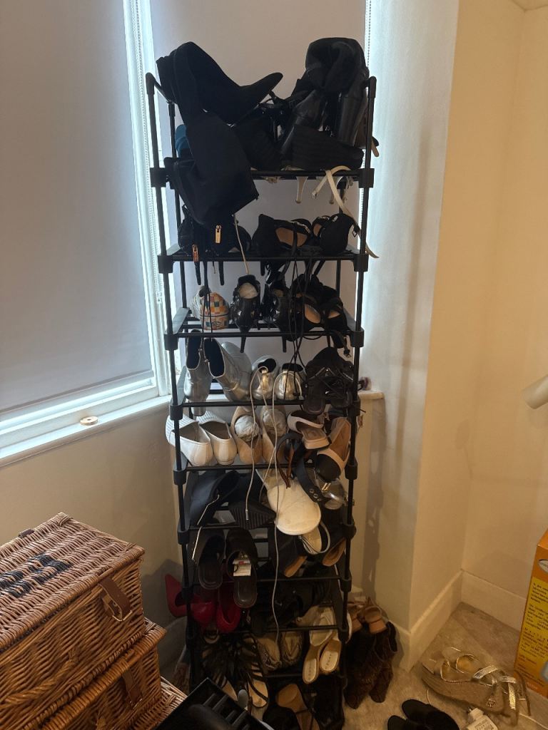 Black plastic with metal frame shoe rack 