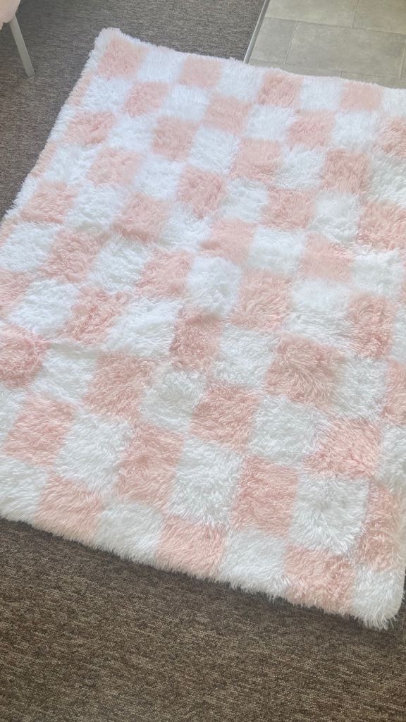 Pink and white fluffy rug