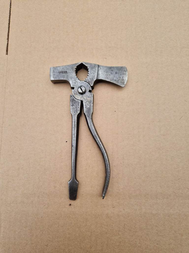 Antique Vintage multi tool wrench hammer axe nail puller screwdriver.