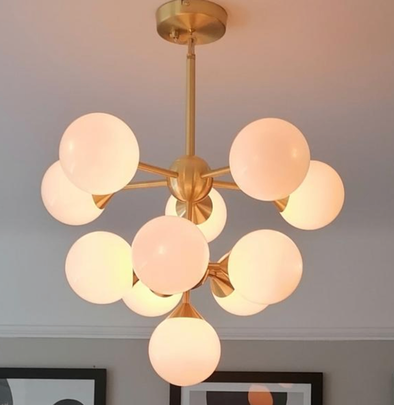 NEW LOW PRICE. stunning sputnik ceiling light, brushed gold finish,still boxed.