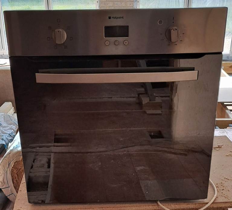 A good condition Hotpoint built-in electric oven in silver