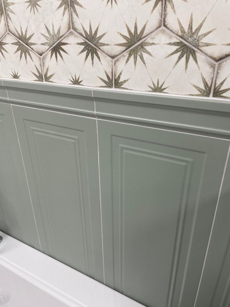 Sage green ceramic panelling and border