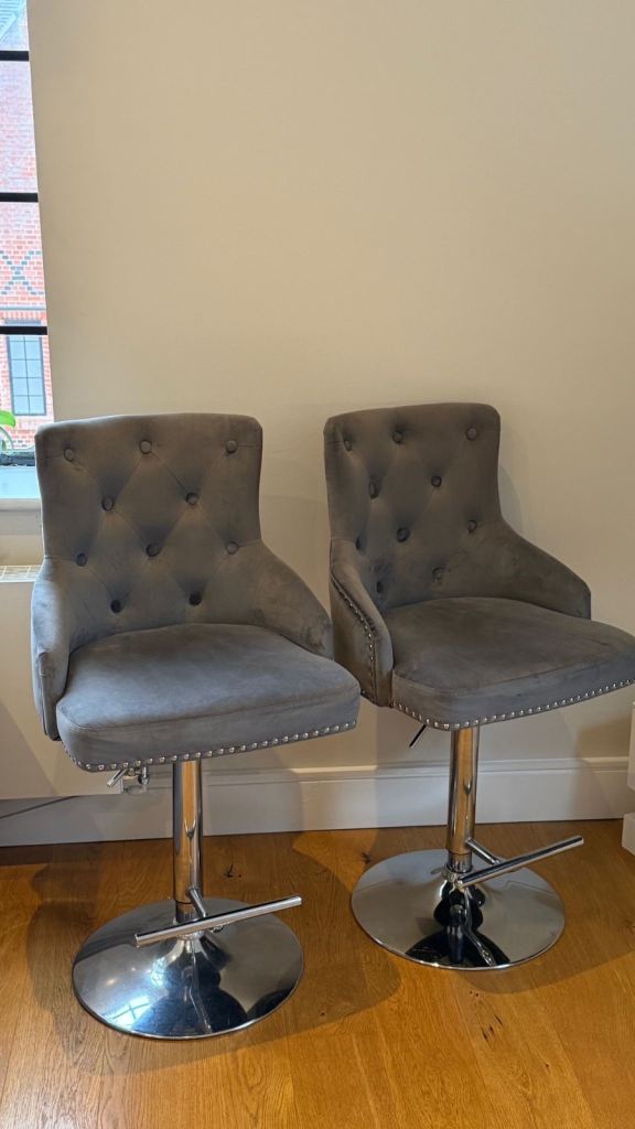 Two grey breakfast bar gas lift chairs. In full working order. 