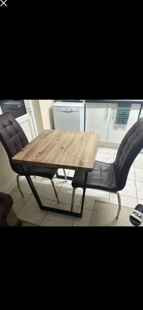 Free local delivery smallish space saving dinner table with two chairs 