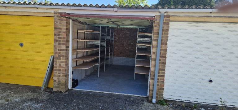 Garage to let in Mulberry Close, Lancing, fitted with shelves and solar power