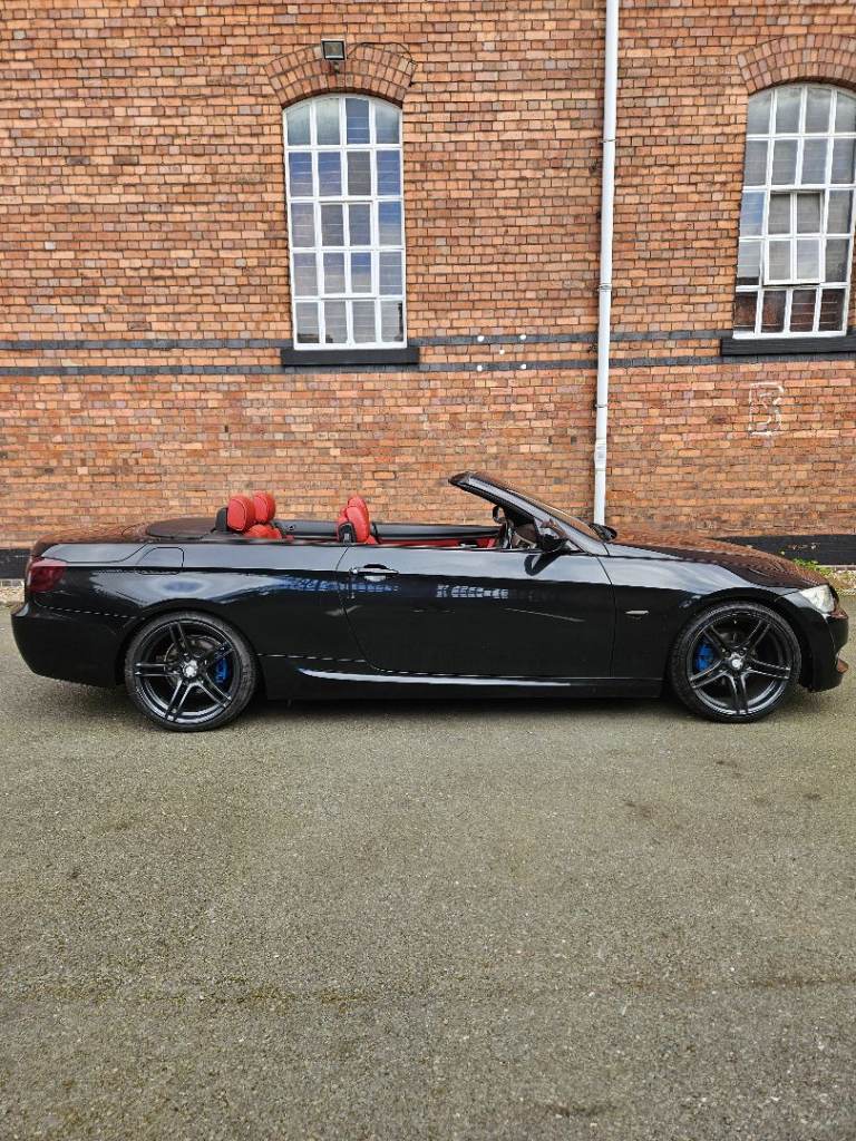 Convertable BMW 3 Series with red leather seats