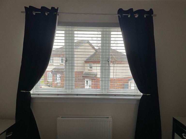 Next black curtain with silver pole and tie backs 