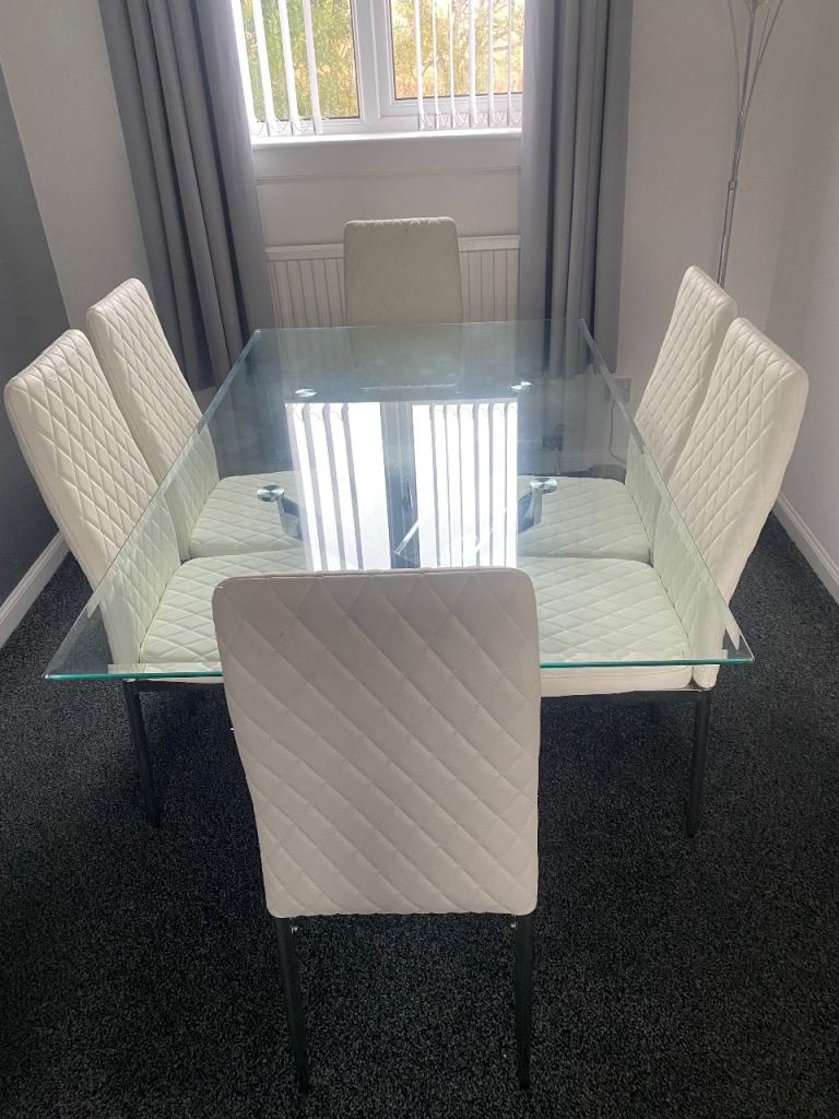 Glass Dining Table with 6 White Faux Leather Chairs – Good Condition