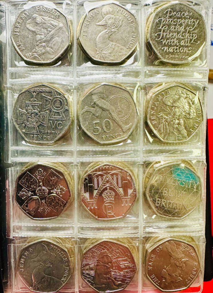 Various coins with designs. 