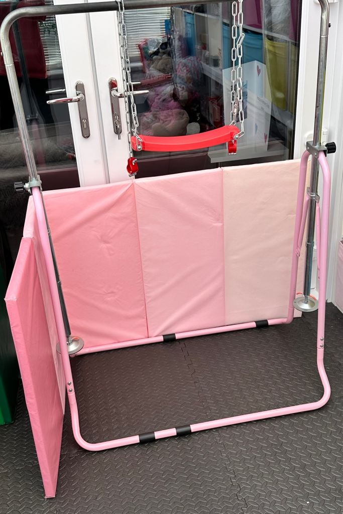 Kids pink gymnastics bars mat and swing attachment 