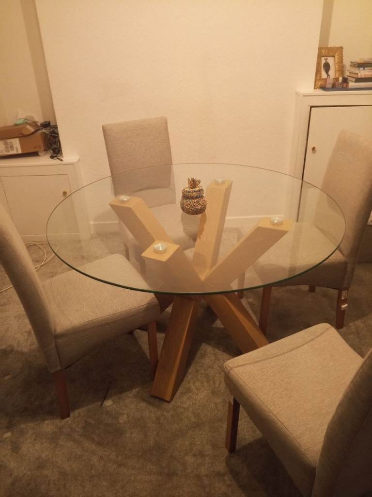 Round glass dining table with chairs 