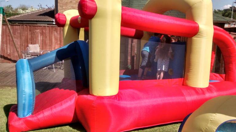 Happy Hop Bouncy Castle – Multicoloured.