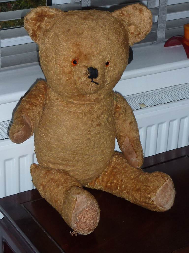 A large, Vintage Playworn Straw Filled Bear with 'Growling' Mechanism.